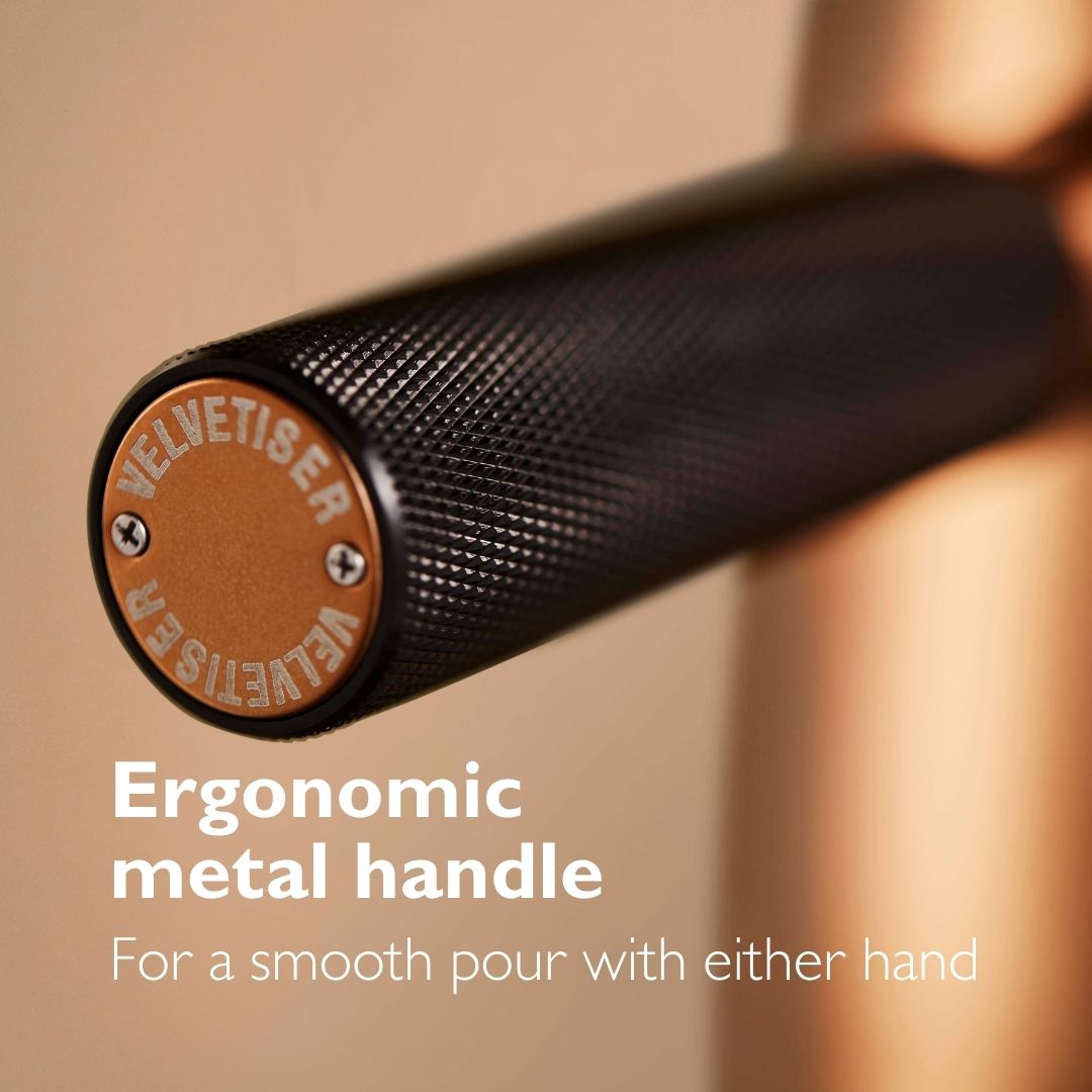 closeup image of velvetiser hot chocolate maker handle with caption about the ambidextrous handle.