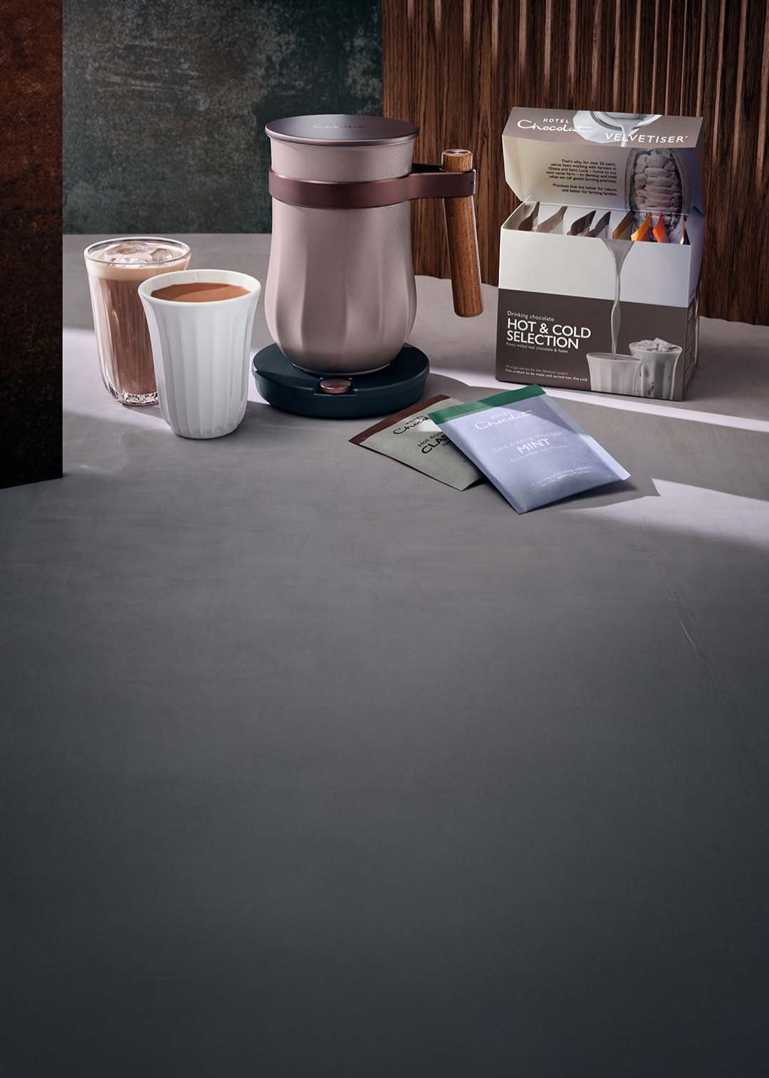 The all new velvetiser, with a cup of hot chocolate and iced drinking chocolate as well as a drinking chocolate variety pacl.