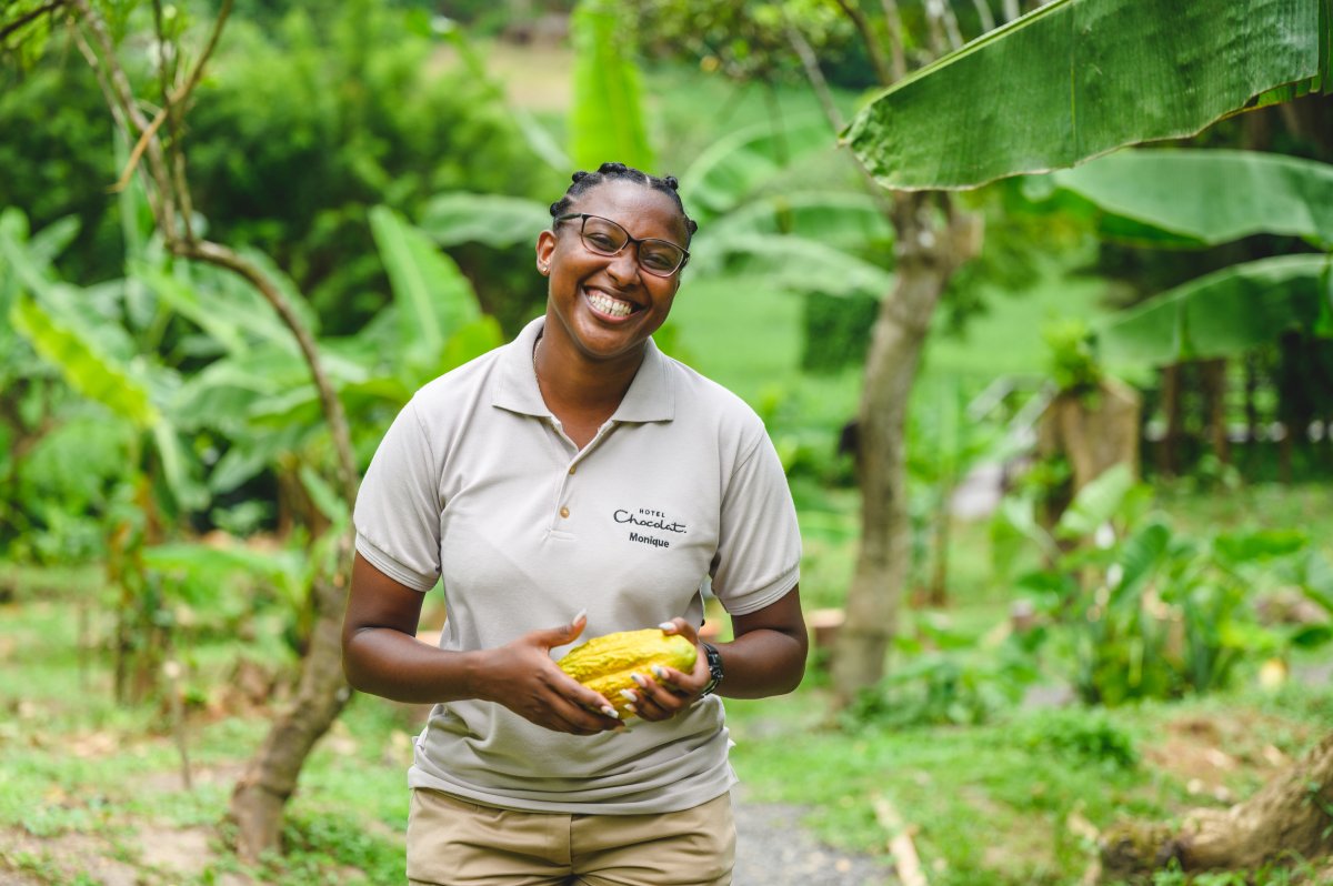 Cacao farmer holding a cacao pod