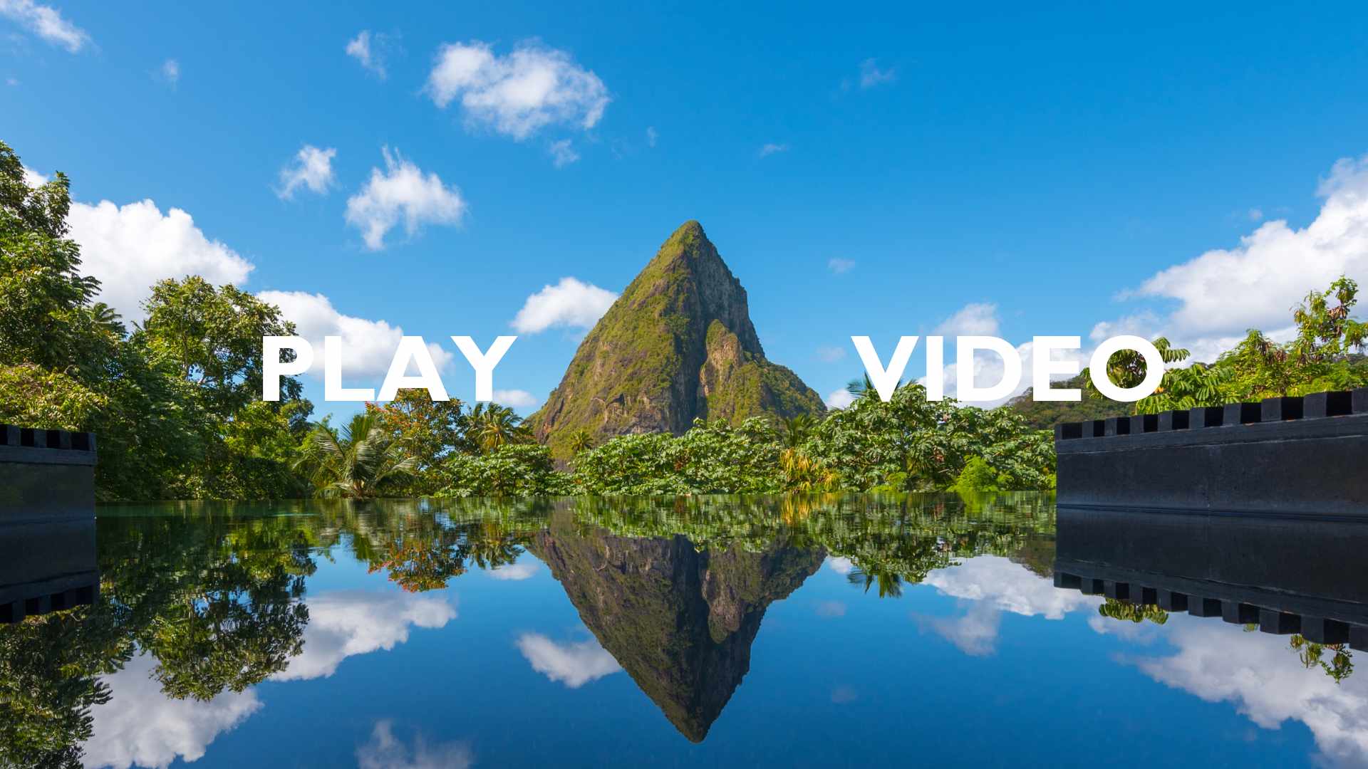 Load video: Video introducing the Rabot Hotel in Saint Lucia. Tour following a woman around the tropical hotel.
