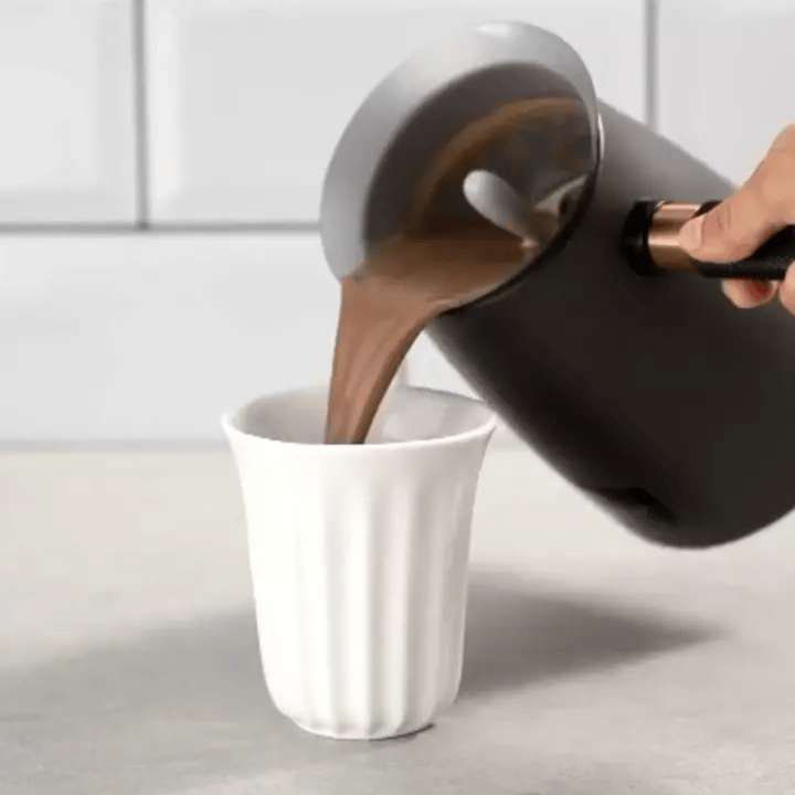 closeup of hot chocolate pouring from velvetiser hot chocolate maker